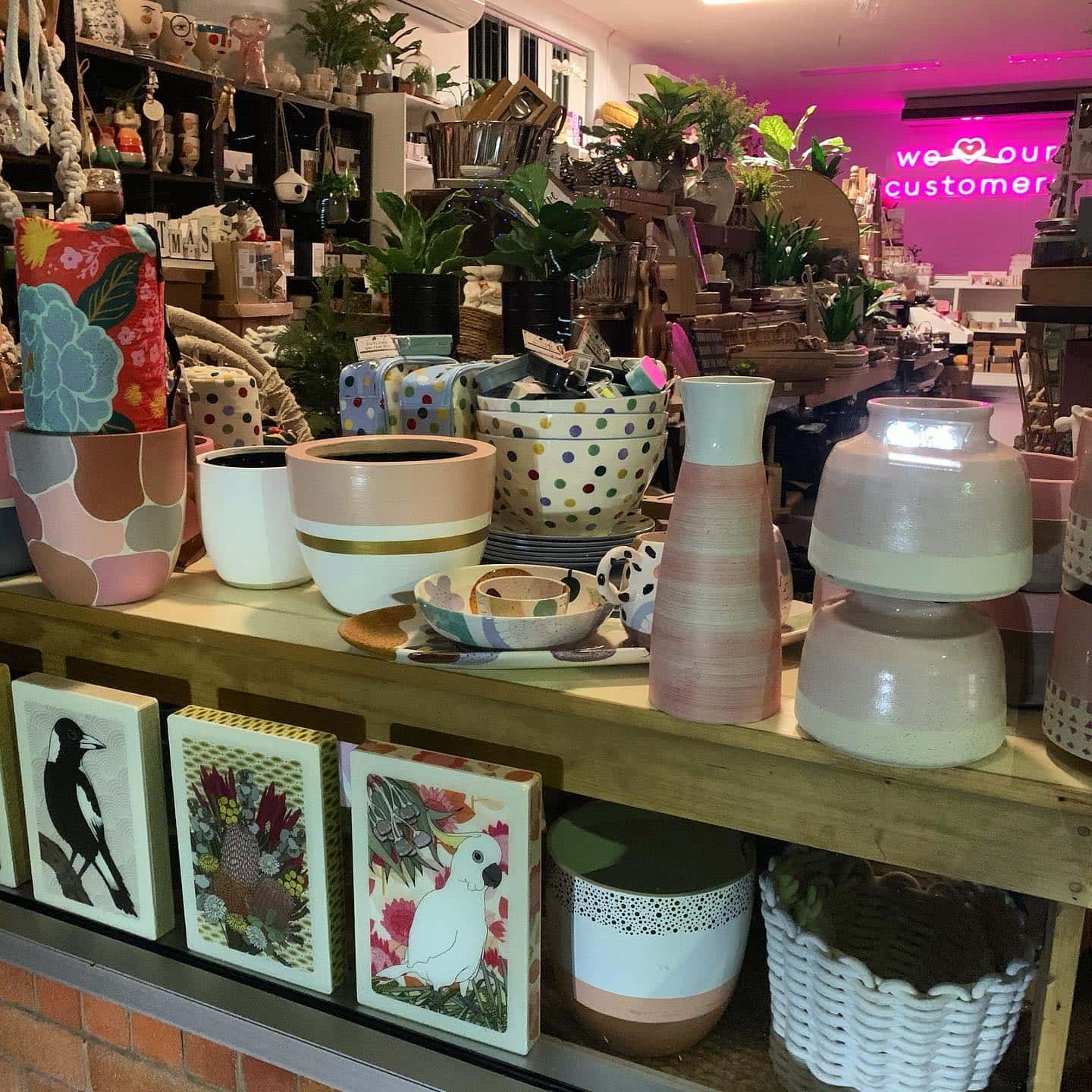 A Display of Colourful Ceramic Pots, Vases, and Artwork in a Shop — Decadence Gifts & Homewares in Emerald, QLD