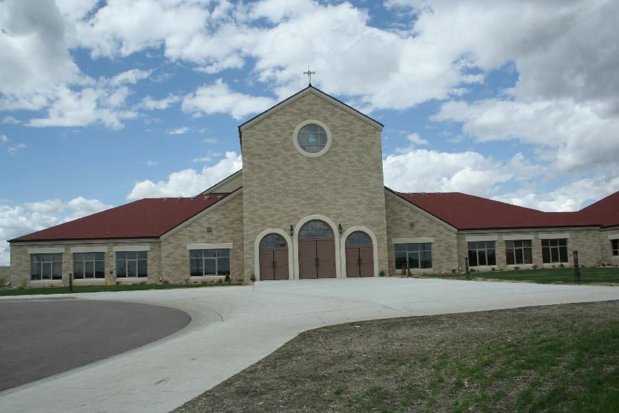 A large brick building with a red roof