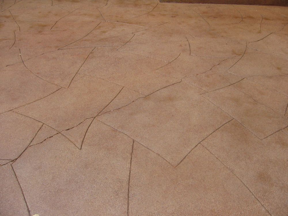 A close up of a concrete floor with a pattern on it