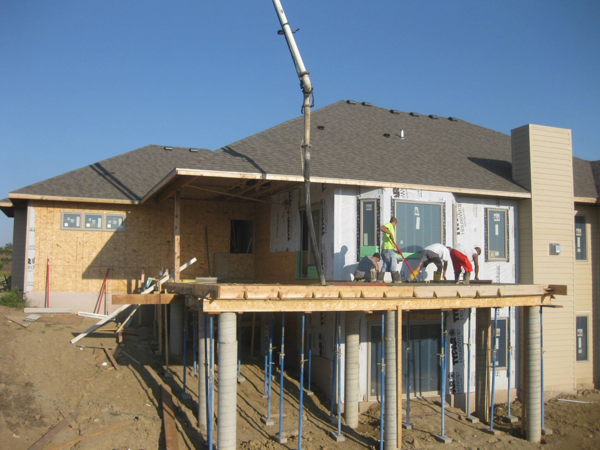 A house that is being built with a concrete pump