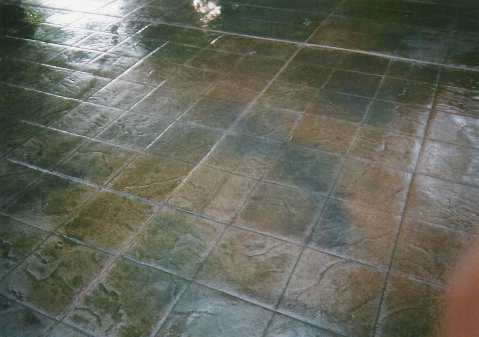A person is standing on a tiled floor in a room.