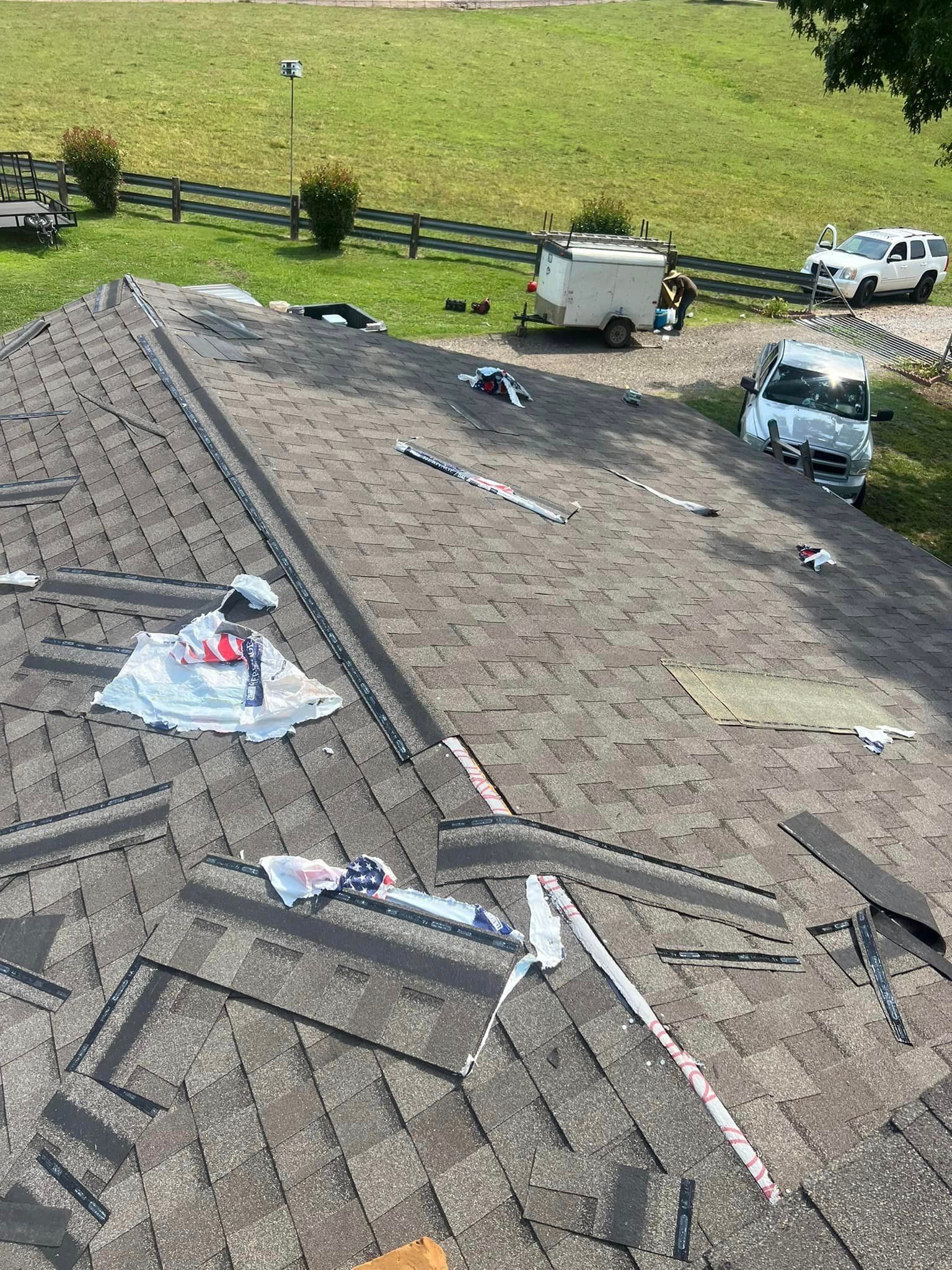 An aerial view of a roof that is being repaired.