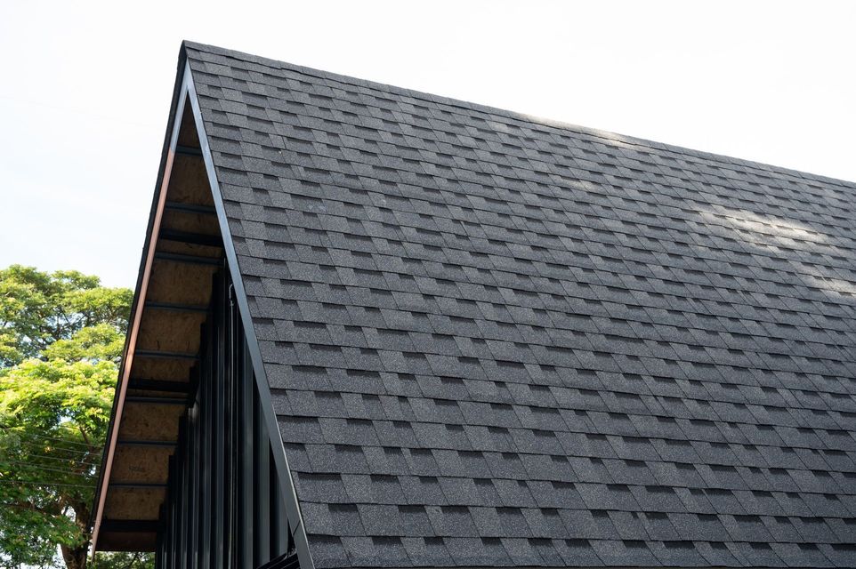 A close up of a black roof on a house.