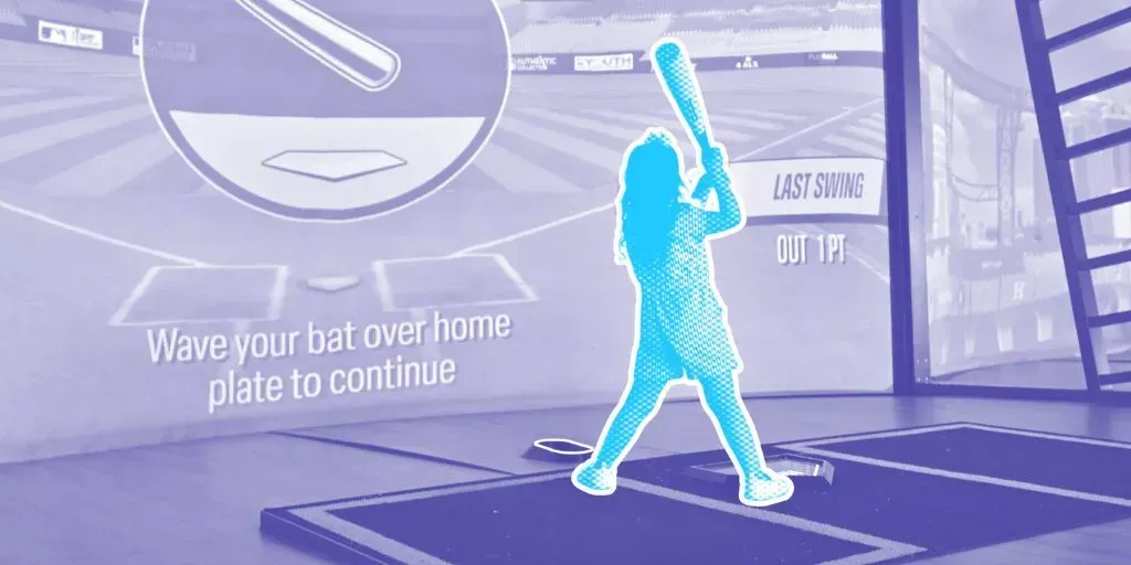 A woman is swinging a bat at a ball in a virtual baseball game.