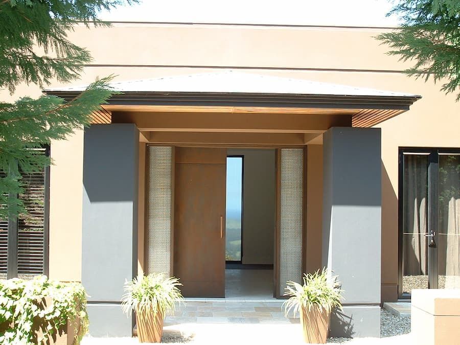 A House With A Large Door And A Few Potted Plants In Front Of It — South Coast Glass In South Nowra, NSW