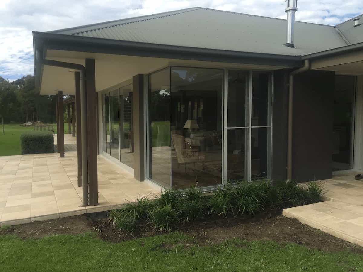 A Large House With A Lot Of Windows And A Patio — South Coast Glass In South Nowra, NSW