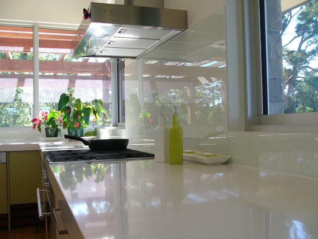 A Kitchen With A Pan On The Stove And A Window — South Coast Glass In South Nowra, NSW