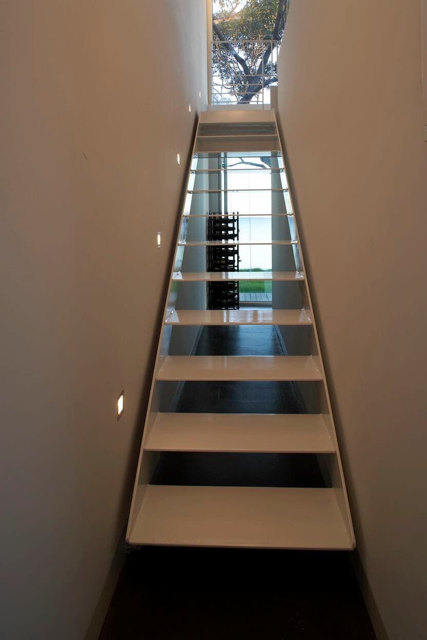 A Staircase Leading Up To A Window With A Tree In The Background — South Coast Glass In South Nowra, NSW