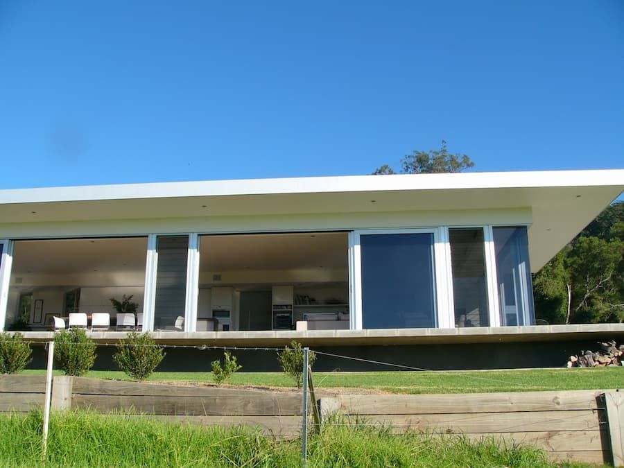 A Large White House With A Lot Of Windows — South Coast Glass In South Nowra, NSW