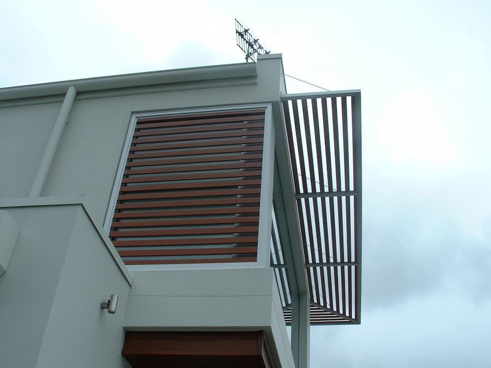 A Building With A Balcony And A Satellite Dish On Top Of It — South Coast Glass In South Nowra, NSW