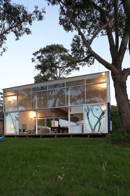 A House With A Lot Of Windows And A Tree In Front Of It — South Coast Glass In South Nowra, NSW