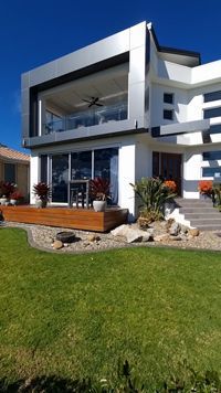 A Large White House With A Large Lawn In Front Of It — South Coast Glass In South Nowra, NSW