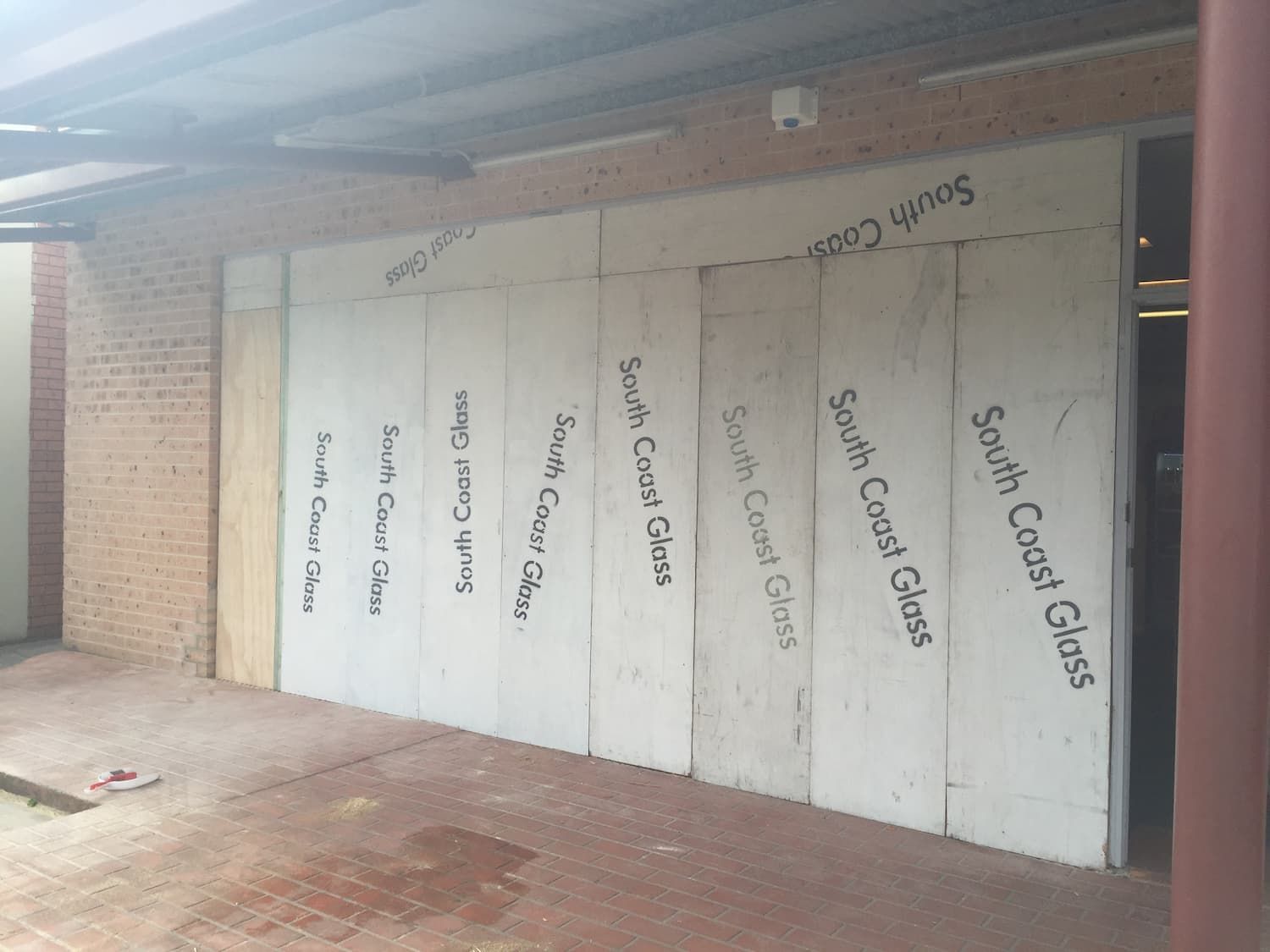 A White Wall With The Words South Coast Glass Written On It — South Coast Glass In South Nowra, NSW