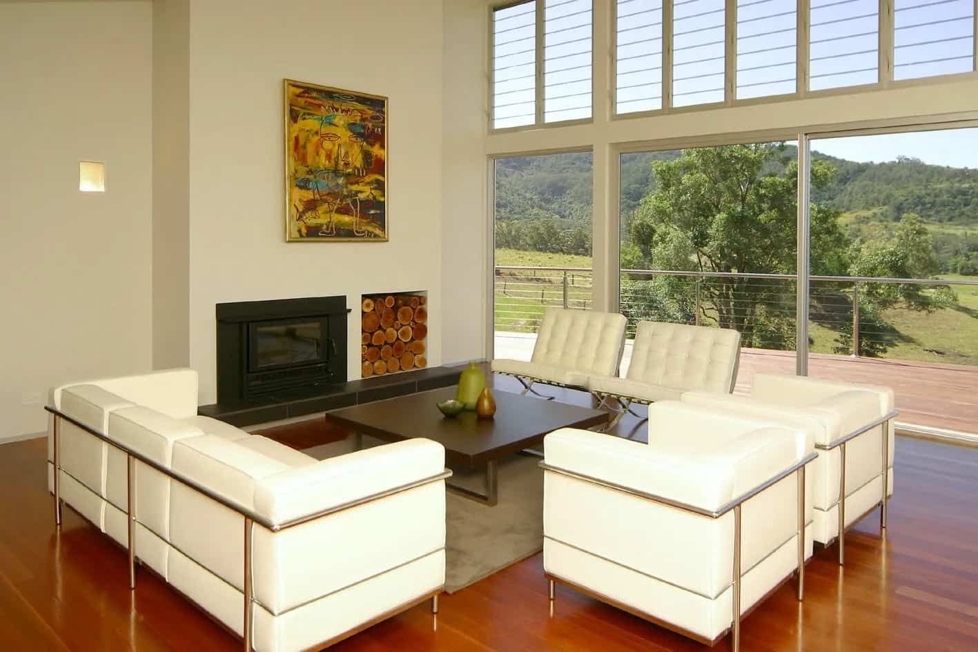 A Living Room With White Furniture And A Fireplace — South Coast Glass In South Nowra, NSW