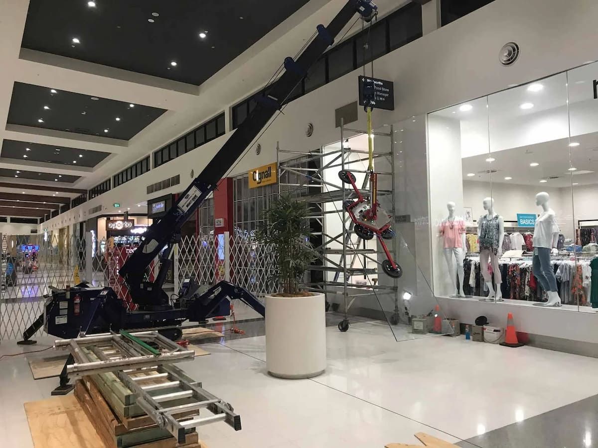 A Crane Is Sitting In The Middle Of A Shopping Mall — South Coast Glass In Nowra, NSW