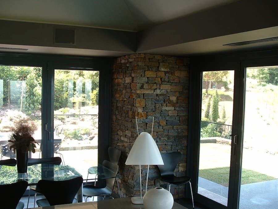 A Living Room With A Table And Chairs And A Lamp — South Coast Glass In South Nowra, NSW