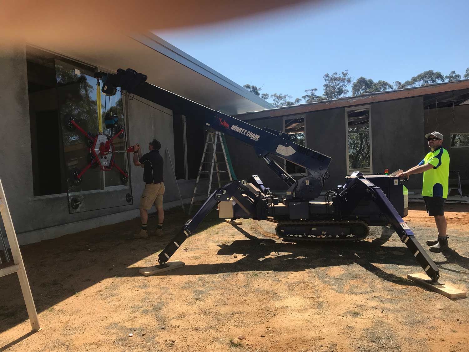 A Blue Crane Using for Glass Installation — South Coast Glass In South Nowra, NSW