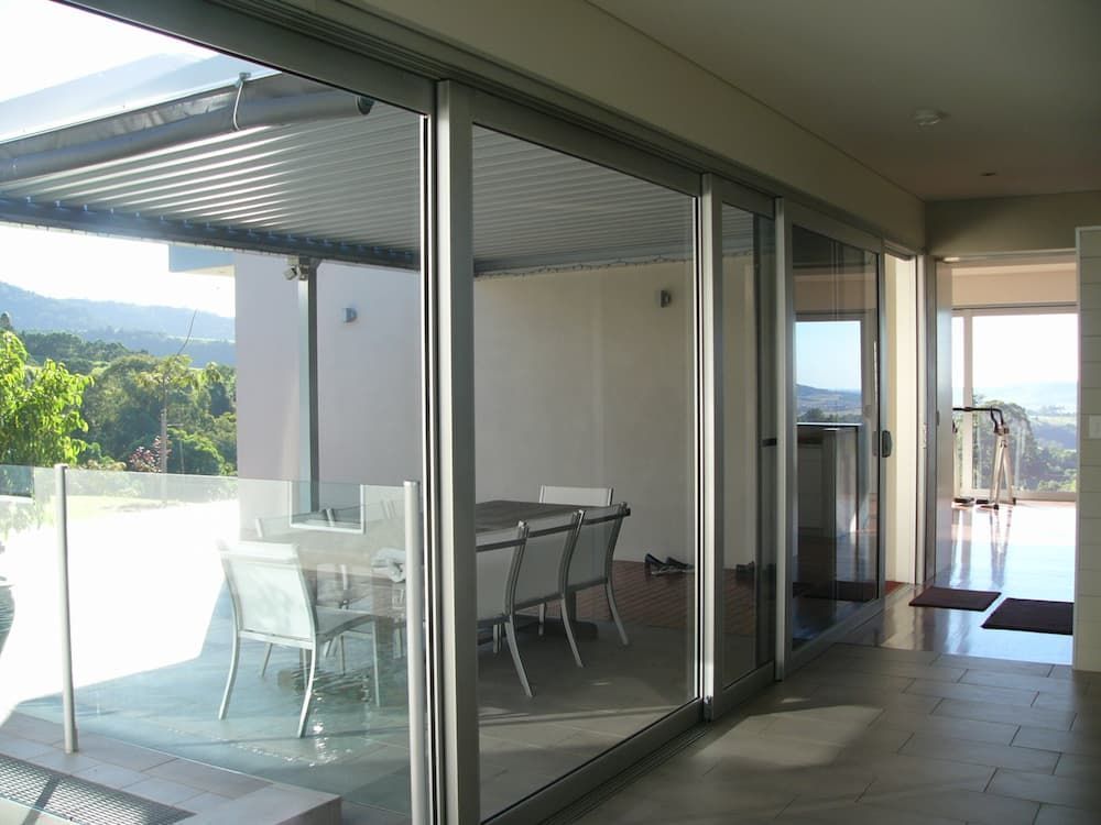 A Dining Room With A Table And Chairs In It — South Coast Glass In South Nowra, NSW