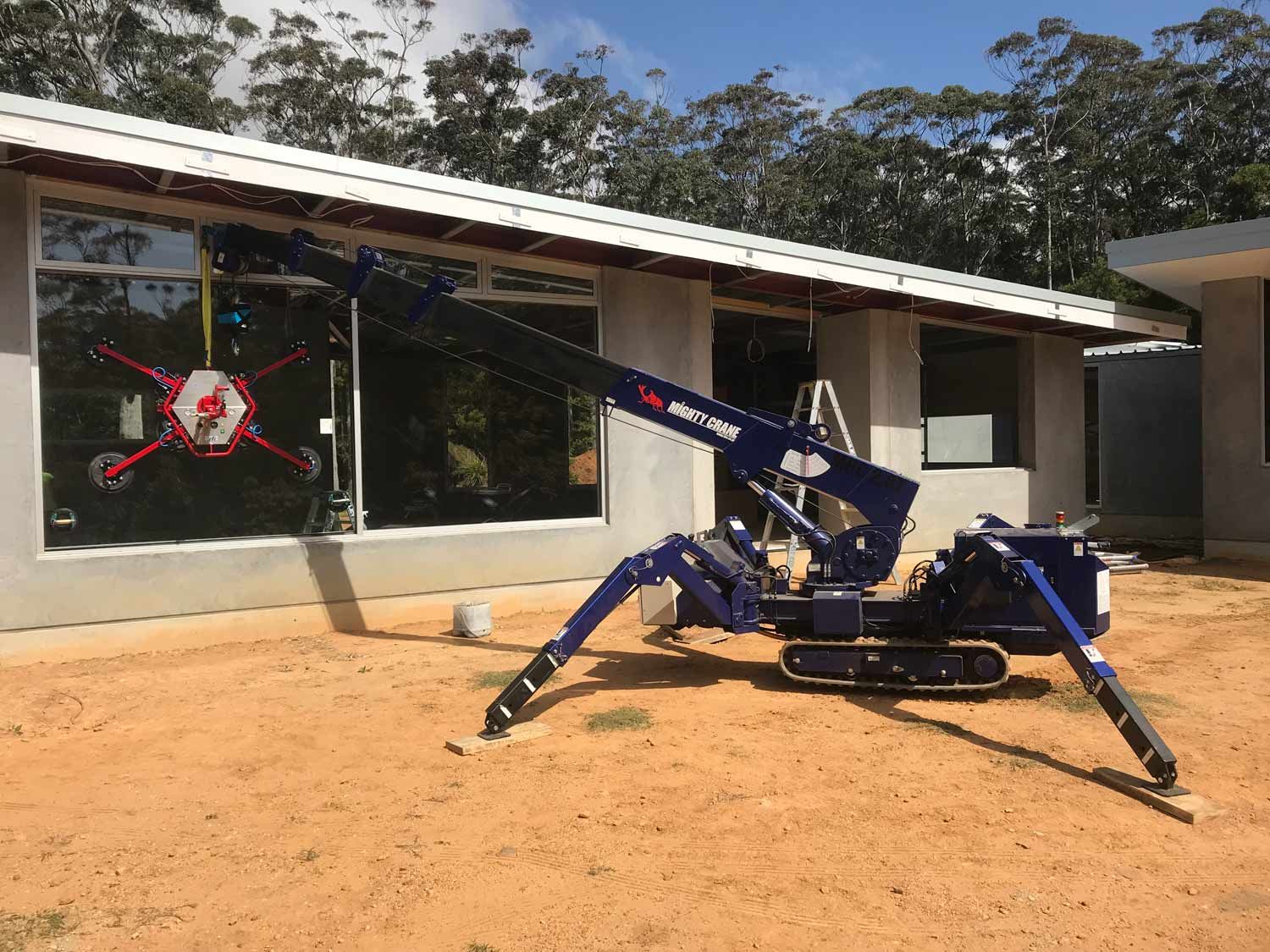 A Crane Truck Installing Windows — South Coast Glass In South Nowra, NSW