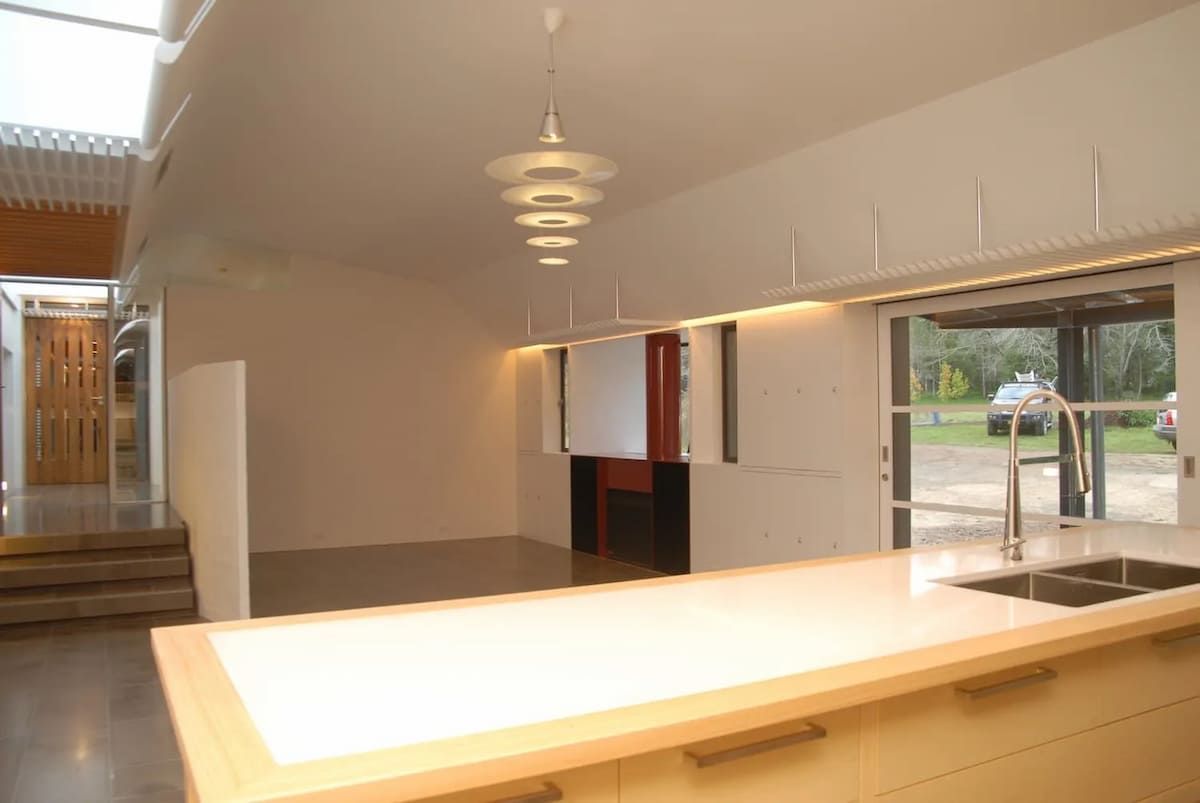 A Kitchen With White Cabinets And A Large Island — South Coast Glass In South Nowra, NSW