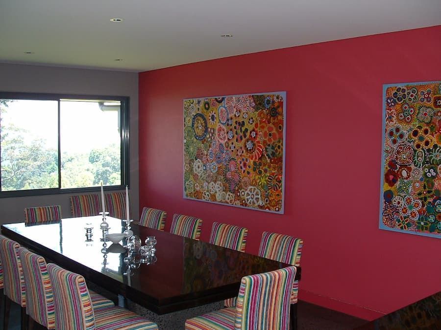 A Dining Room With A Table And Chairs And A Pink Wall — South Coast Glass In South Nowra, NSW