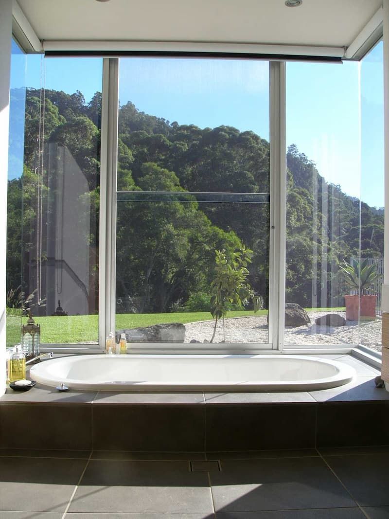 A Bathtub In A Bathroom With A Large Window — South Coast Glass In South Nowra, NSW