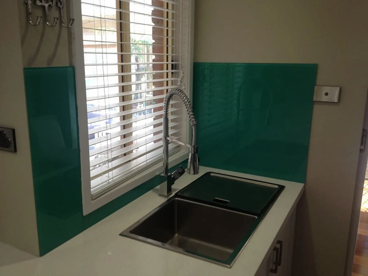 A Kitchen With A Sink And A Window With Blinds — South Coast Glass In South Nowra, NSW