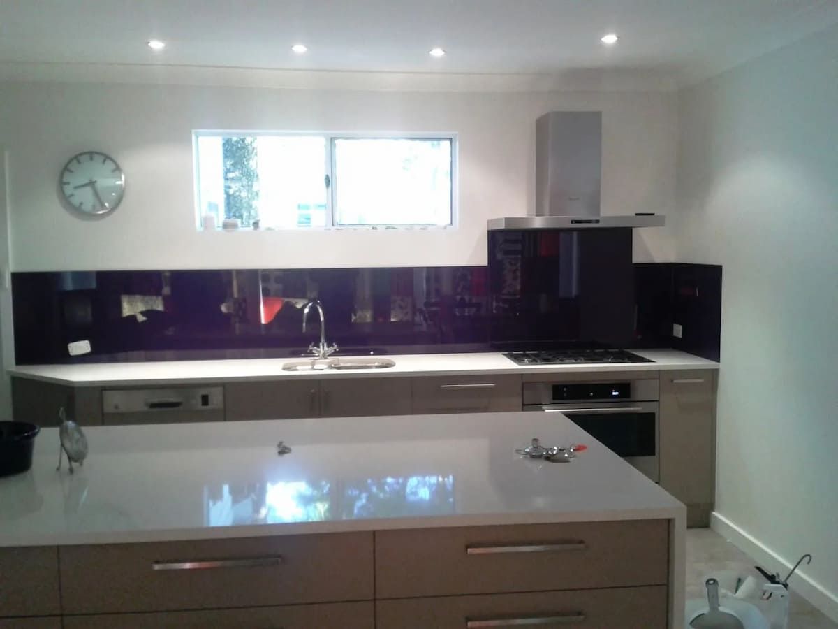 A Kitchen With A Sink And A Clock On The Wall — South Coast Glass In South Nowra, NSW