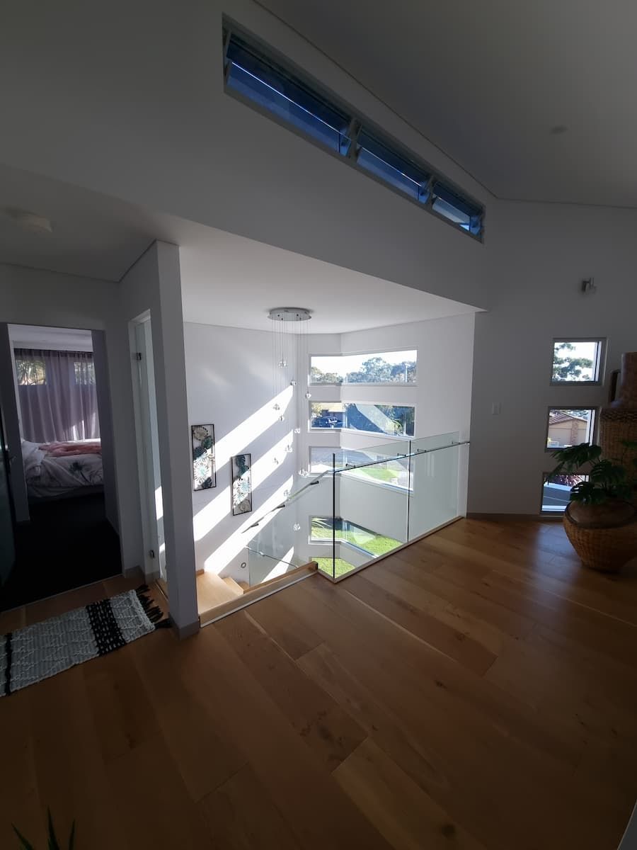 A Staircase In A House With A Glass Railing — South Coast Glass In South Nowra, NSW