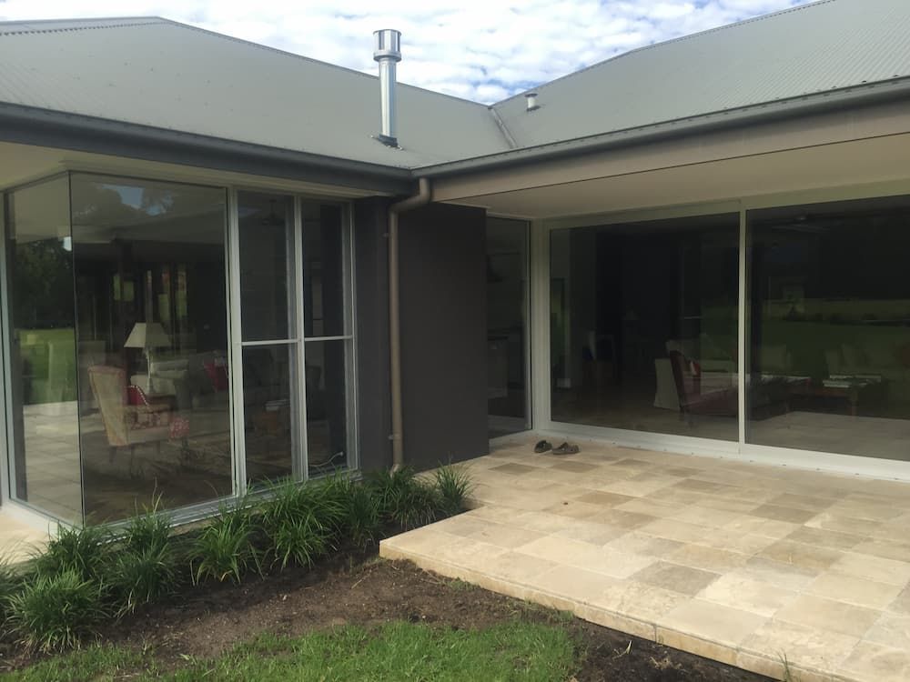 A House With A Lot Of Windows And A Patio In Front Of It — South Coast Glass In South Nowra, NSW
