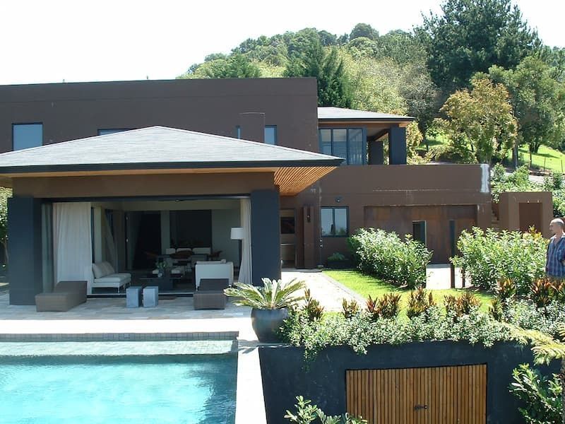 A Large House With A Swimming Pool In Front Of It — South Coast Glass In South Nowra, NSW