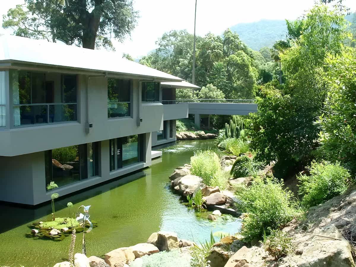 A House With A Pond In Front Of It — South Coast Glass In Berry, NSW