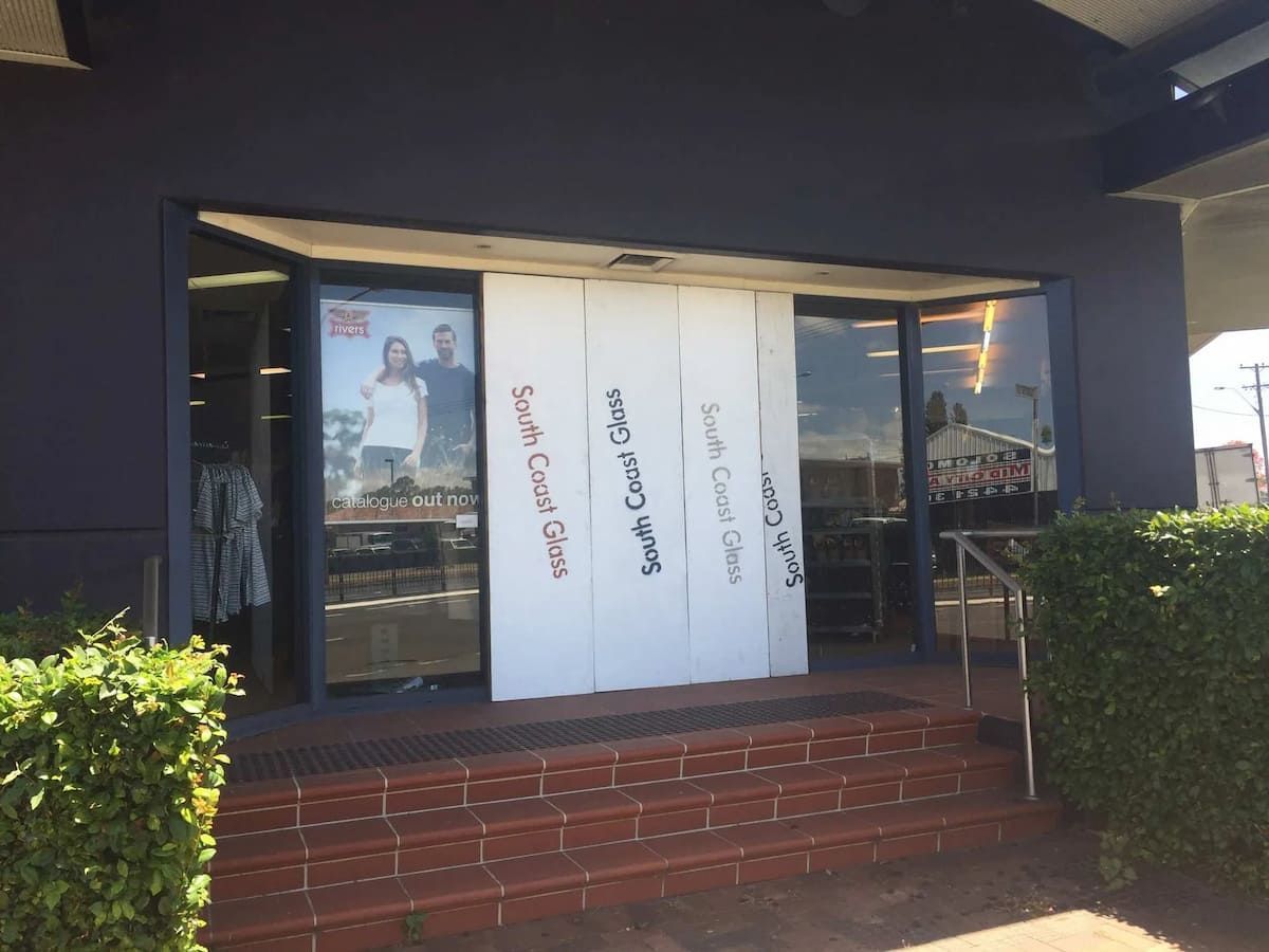 A Store Front With A Sign That Says Surf Coco Drive — South Coast Glass In Nowra, NSW