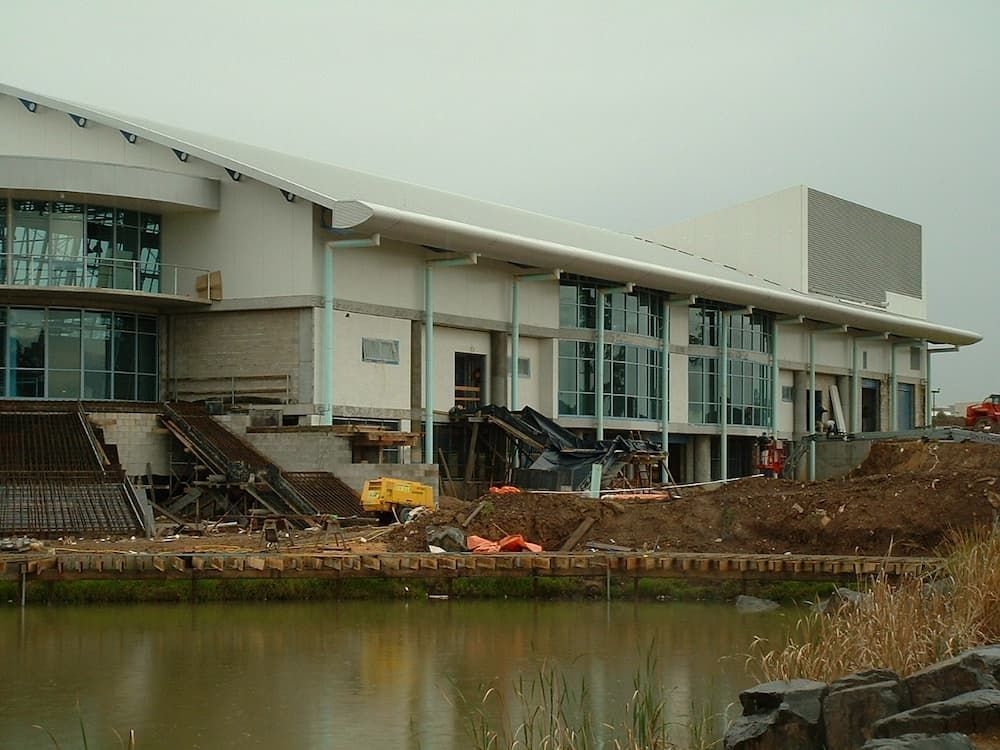 A Large Building Is Being Built Next To A Body Of Water — South Coast Glass In South Nowra, NSW
