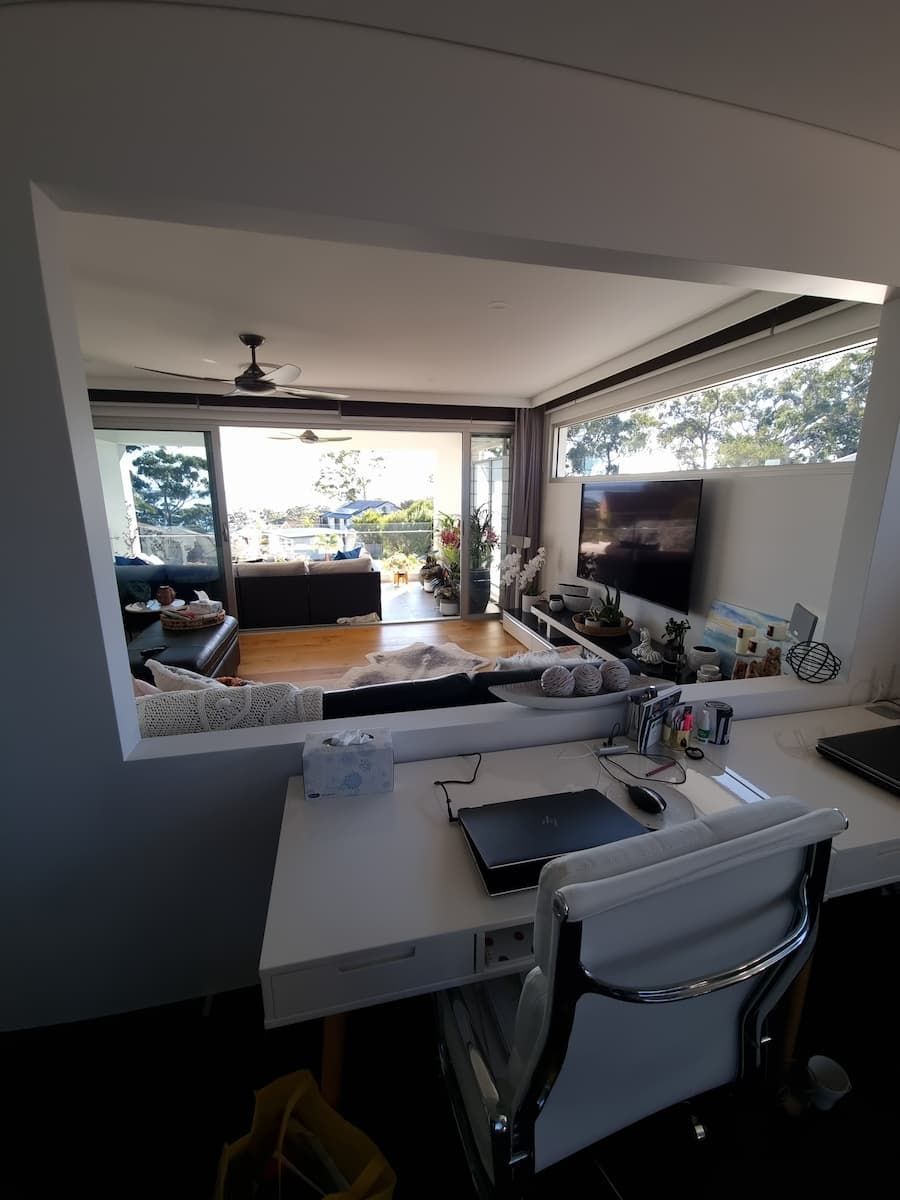 There Is A Desk In The Middle Of The Room With A View Of The Living Room — South Coast Glass In South Nowra, NSW