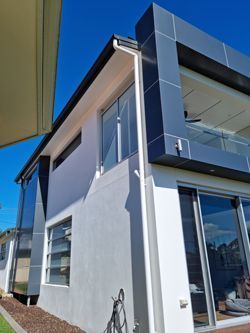 A Large House With A Lot Of Windows And A Balcony — South Coast Glass In South Nowra, NSW