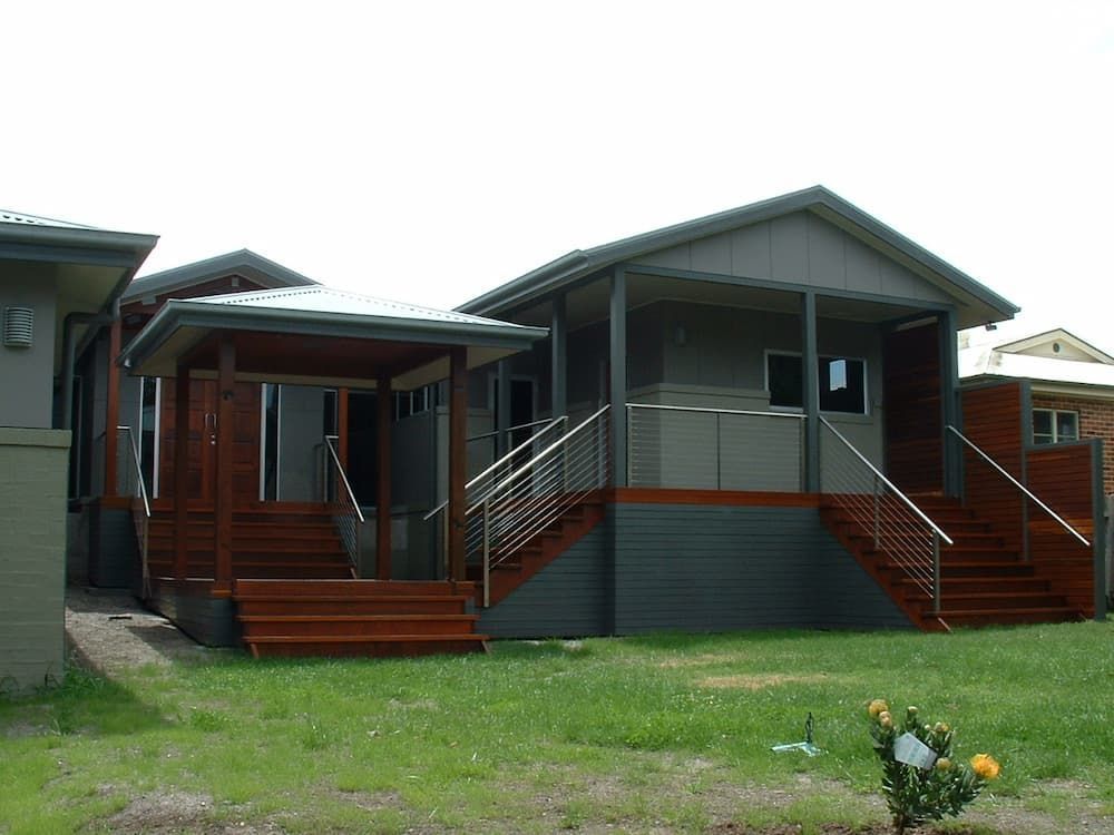 A House With Stairs Leading Up To The Front Porch — South Coast Glass In South Nowra, NSW
