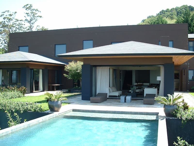 A Large House With A Swimming Pool In Front Of It — South Coast Glass In South Nowra, NSW