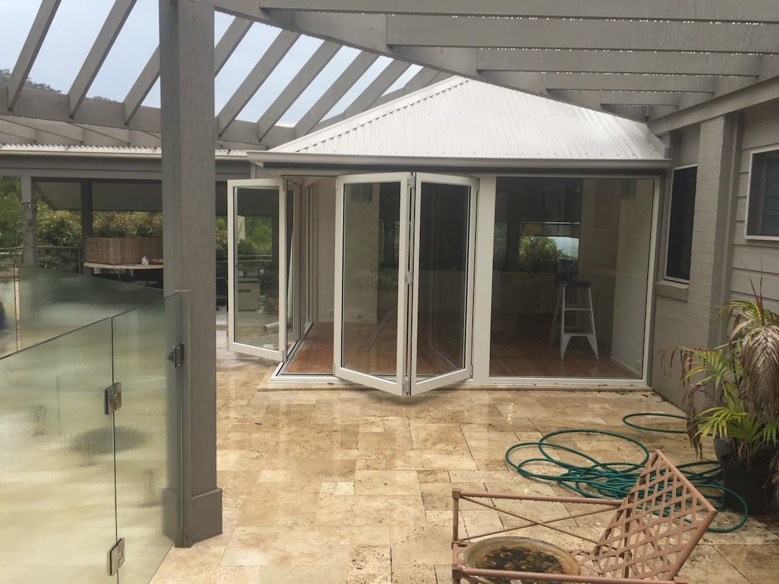A Patio With A Chair And A Hose In Front Of A House — South Coast Glass In South Nowra, NSW
