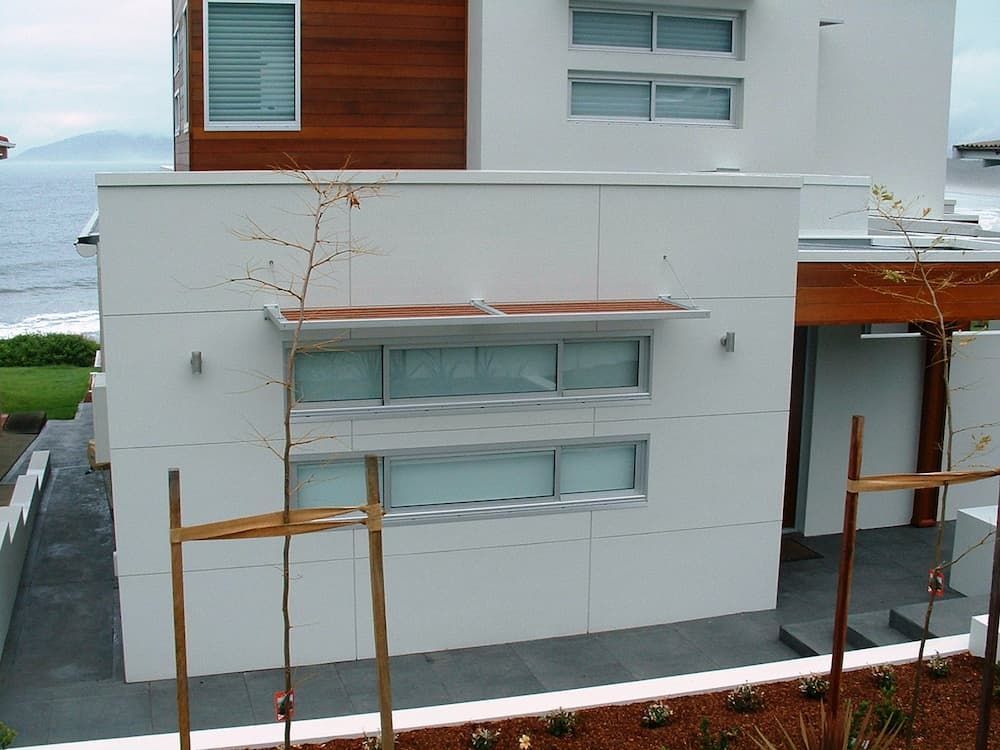 A House With A Lot Of Windows And A View Of The Ocean — South Coast Glass In South Nowra, NSW