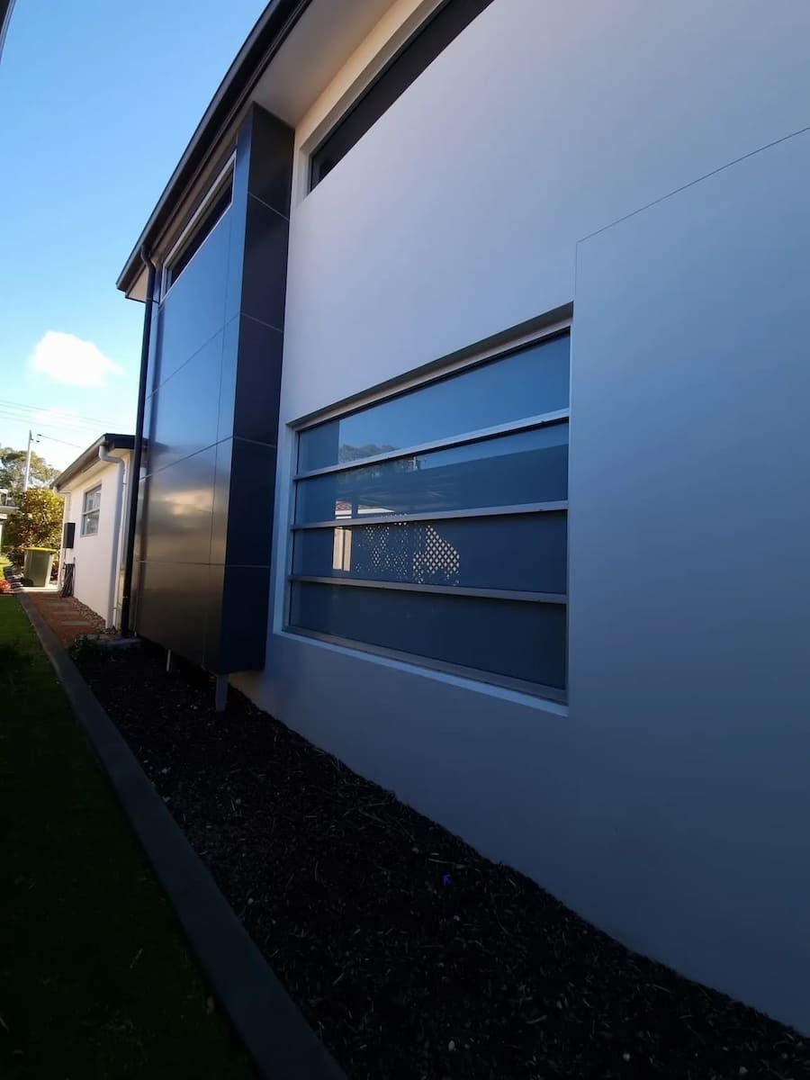 A House With A Lot Of Windows On The Side Of It — South Coast Glass In South Nowra, NSW