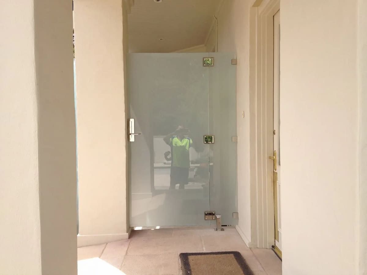 A Hallway With A Glass Door And A Rug On The Floor — South Coast Glass In South Nowra, NSW