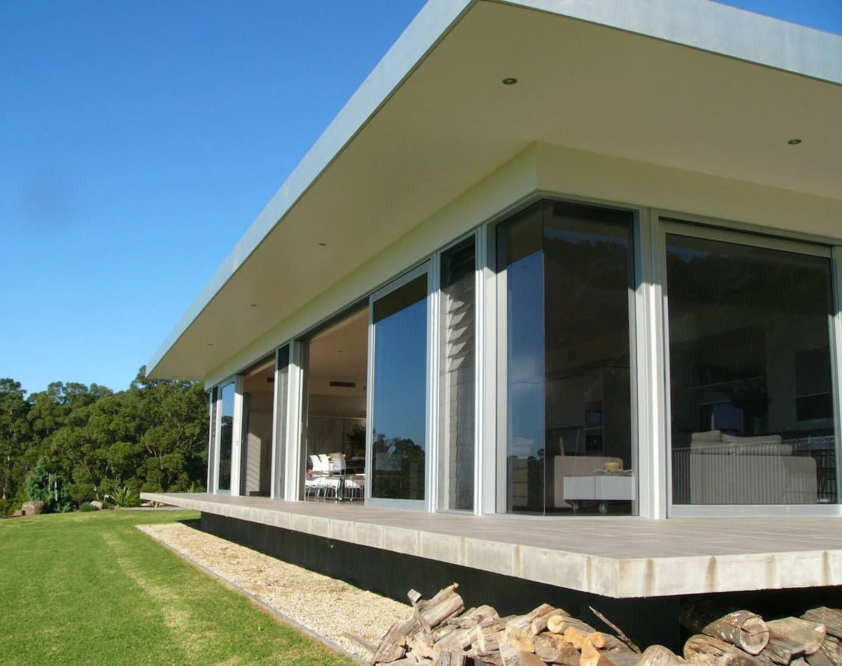 A House With A Lot Of Windows And A Deck — South Coast Glass In South Nowra, NSW