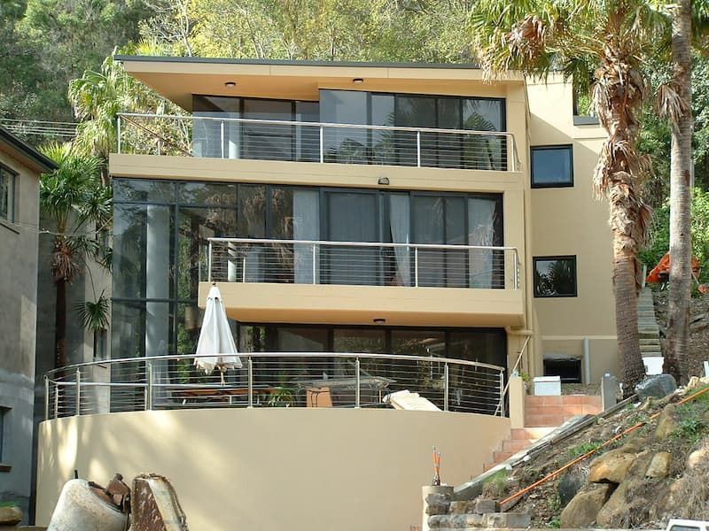 A Large House With A Lot Of Windows And Balconies — South Coast Glass In South Nowra, NSW