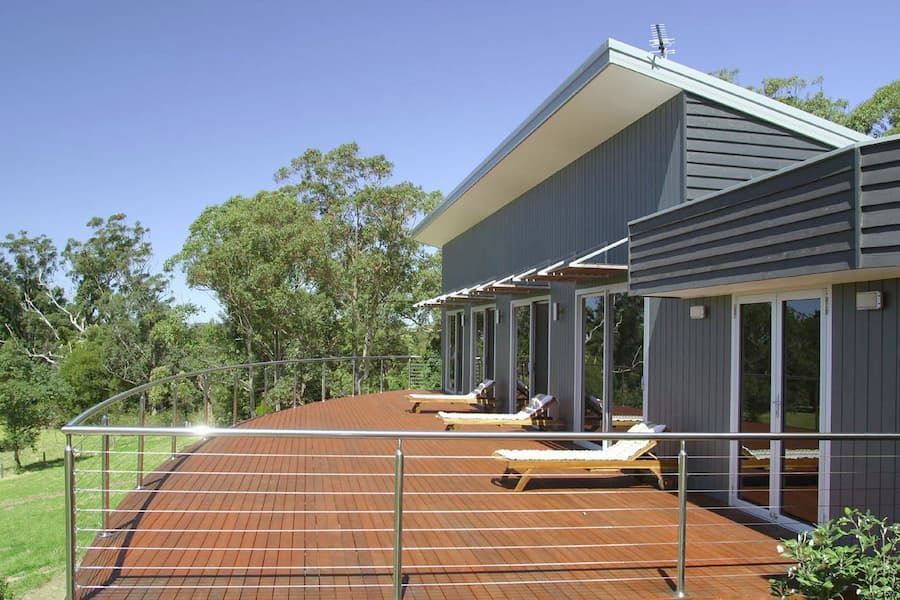 A House With A Large Deck And A Stainless Steel Railing — South Coast Glass In South Nowra, NSW