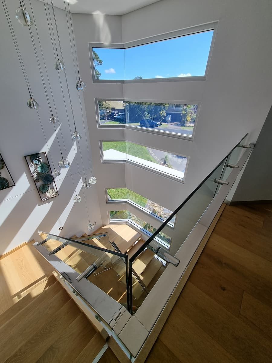 A Staircase With A Glass Railing And A Lot Of Windows — South Coast Glass In South Nowra, NSW