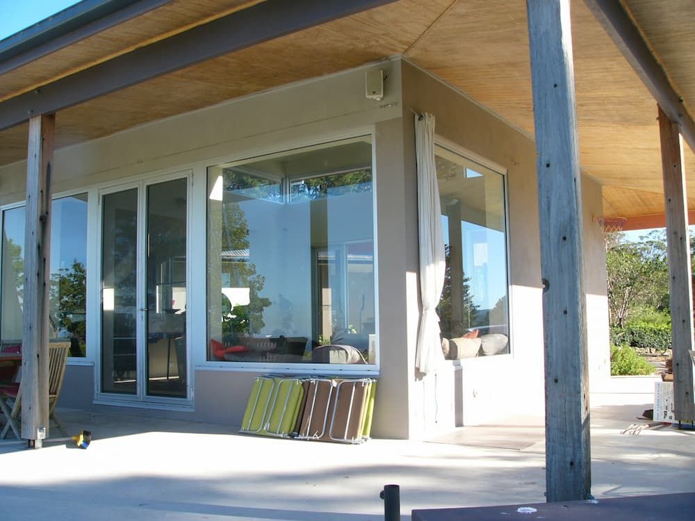 A House With A Lot Of Windows And A Porch — South Coast Glass In South Nowra, NSW