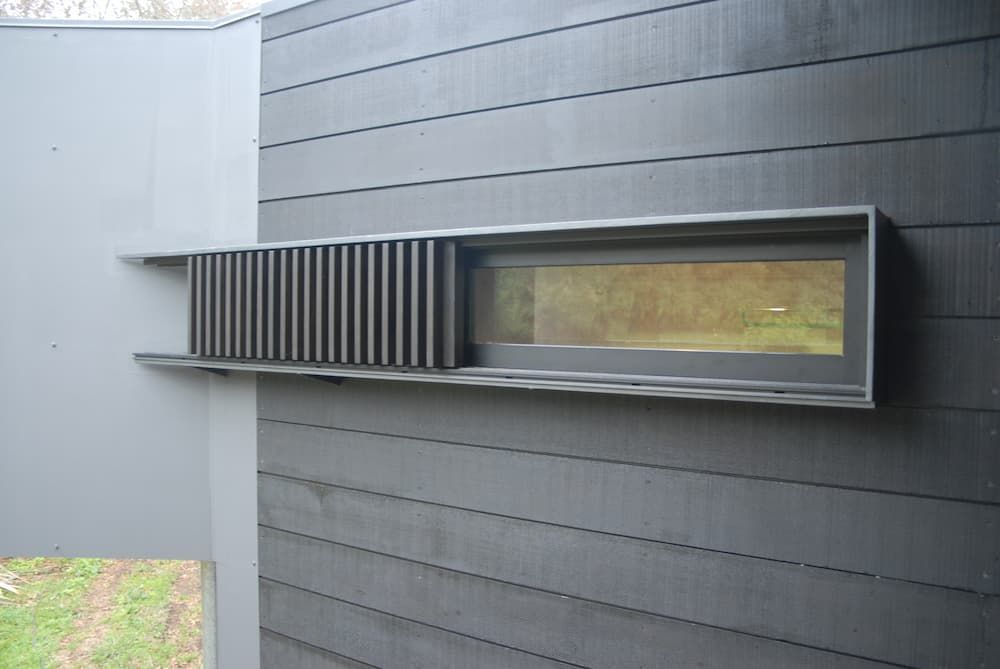 A Grey Wall With A Window And A Shelf On It — South Coast Glass In South Nowra, NSW