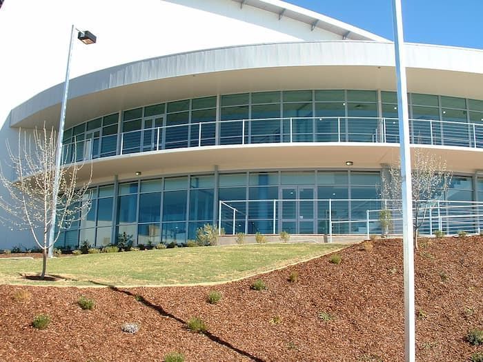 A Large White Building With A Lot Of Windows — South Coast Glass In South Nowra, NSW
