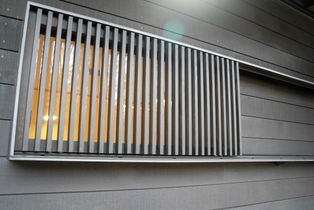 A Window On The Side Of A Building With A Metal Railing — South Coast Glass In South Nowra, NSW